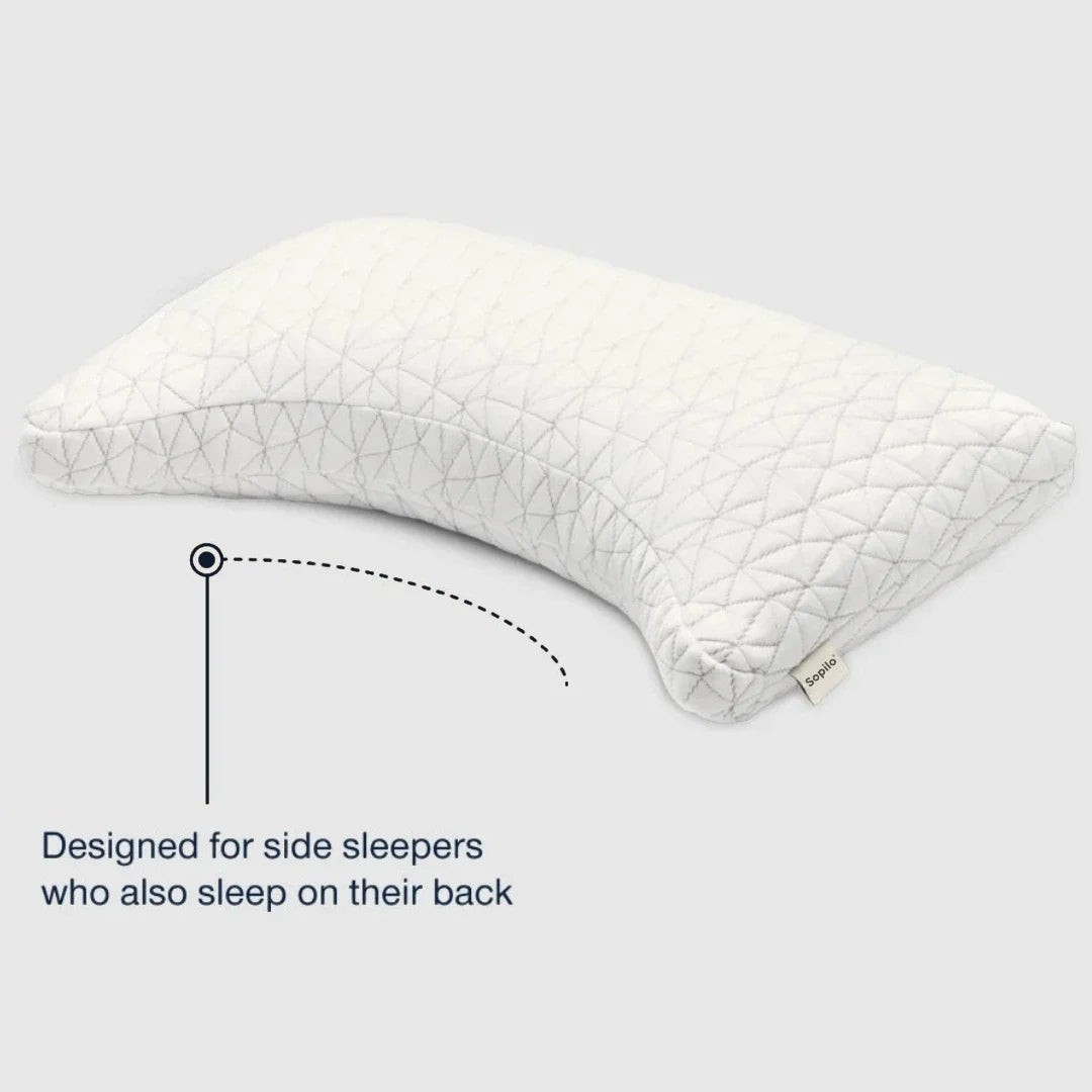 White pillow with geometric pattern on a light gray background