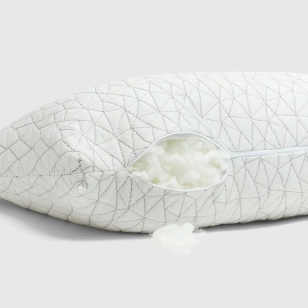 White pillow with geometric pattern on a light gray background